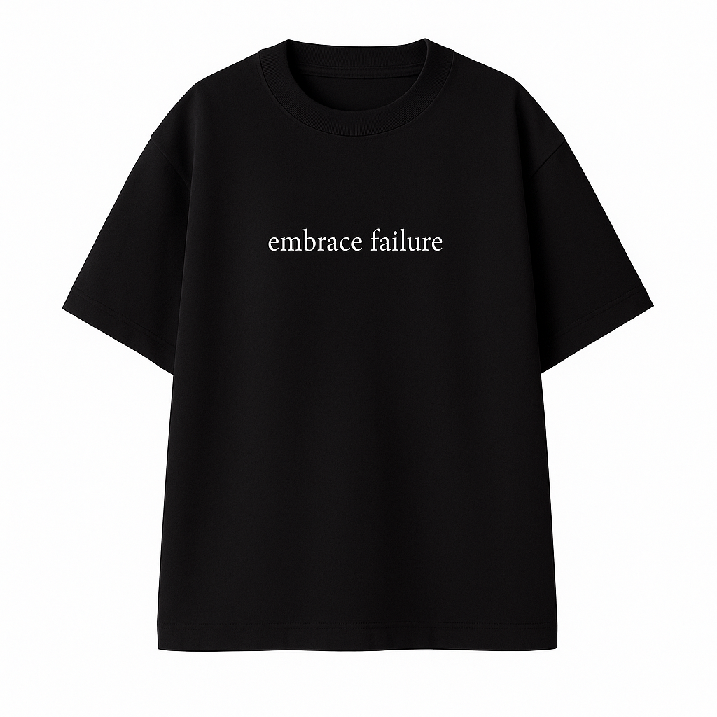 Remera Negra: EMBRACE FAILURE